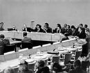 9 June 1947 First meeting of  the Drafting Committee on an International Bill of Rights (Commission on Human Rights), United Nations,  Lake Success, New York (from left to right): Mr. William Roy Hodgson (Australia); Mr. P.C. Chang (China), Vice-Chairman; Mr. Henri Laugier, UN Assistant Secretary-General for Social Affairs; Mrs. Eleanor Roosevelt (USA), Chairman; Mr. John P. Humphrey, Director, UN Human Rights Division; Mr. Charles Malik (Lebanon), Rapporteur; Mr. Vladimir M. Koretsky (USSR); and Mr. H.T. Morgan (United Kingdom) alternate.